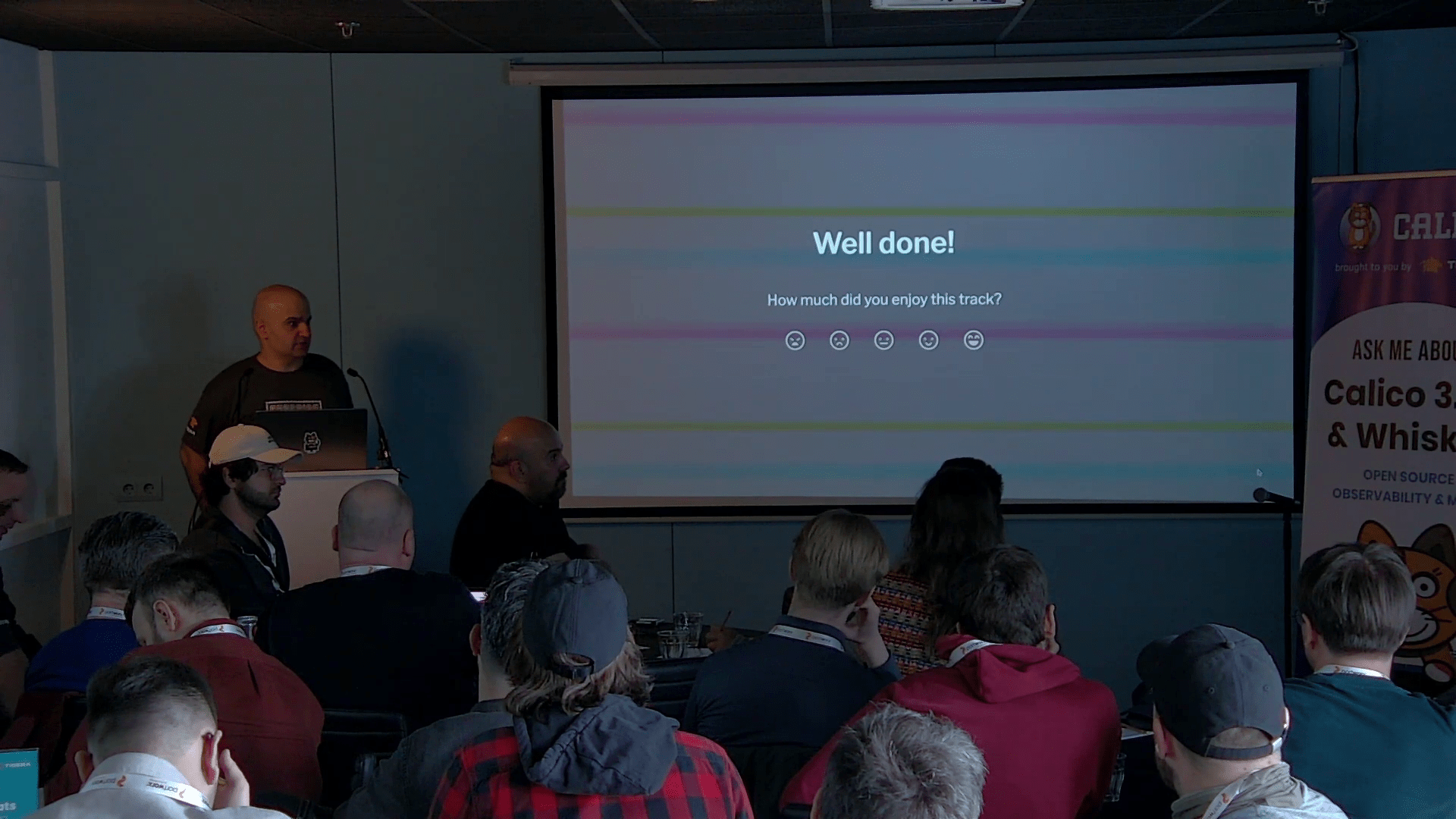 Reza presents Calico 3.30 and Whisker to an audience.